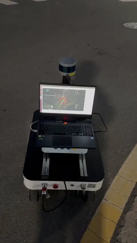 Ranger Mini v2 robot driving from indoors to outdoors and into another campus building