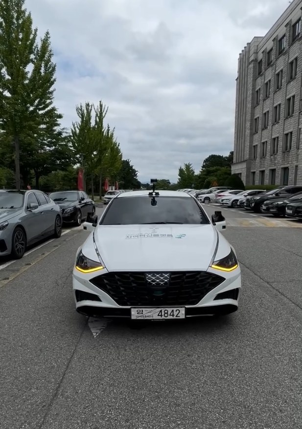 Hyundai Sonata autonomous-driving test vehicle with roof-mounted LiDAR